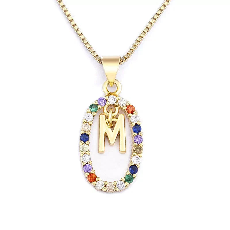 18 karaat vergulde initialen collier met gekleurde stenen